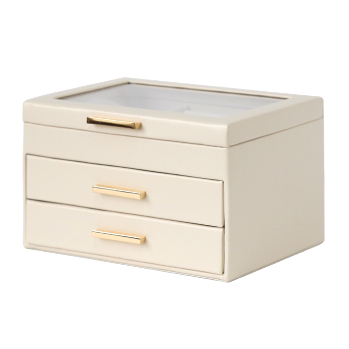Beige jewelry box with gold handles on a white background