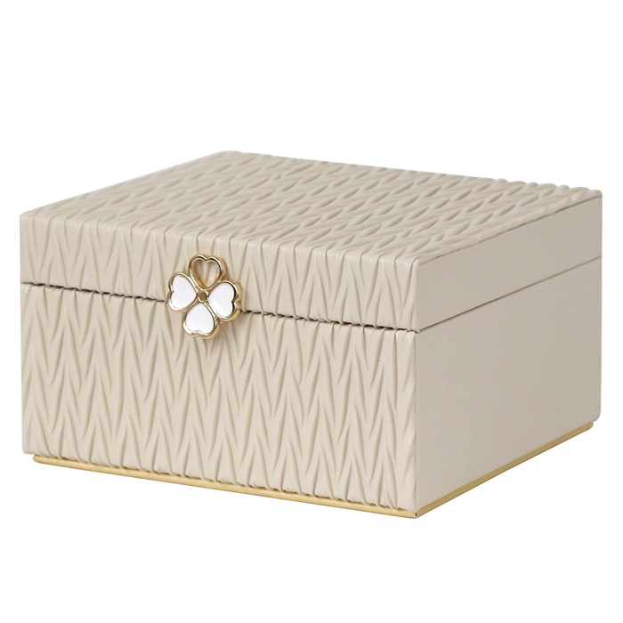 Beige jewelry box with butterfly emblem on a white background