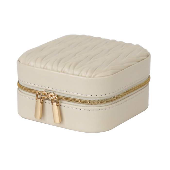 Beige jewelry box with gold zipper on a white background