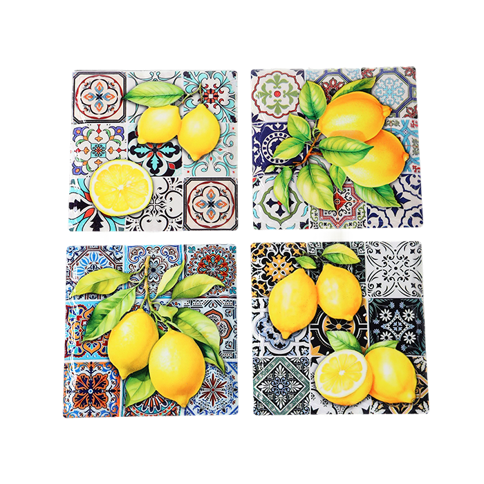 Four decorative tiles with lemon designs on a patterned background