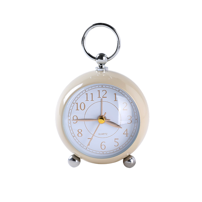 Small round alarm clock with a cream casing and silver accents on a white background