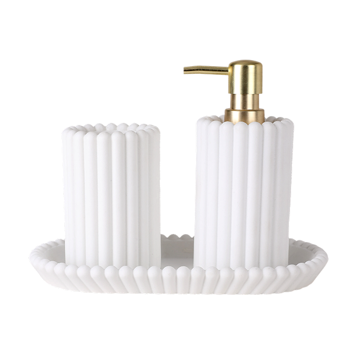 White textured soap dish with gold pump on a white background