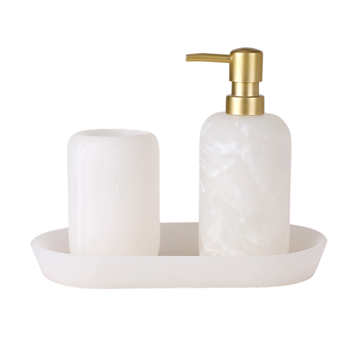White marble soap dispenser with gold pump and matching tray on a white background