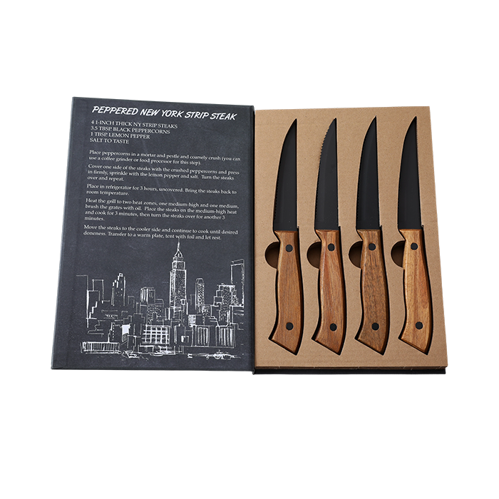 Set of four steak knives with wooden handles in a cardboard box, accompanied by a recipe card on a white background.
